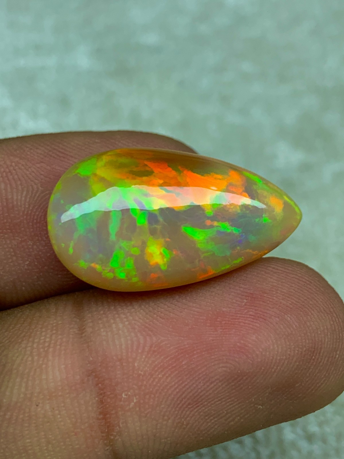 Natural Ethiopian Opal Honeycomb Pattern 14.90 Carat Multi-Fire Pear Cabochon