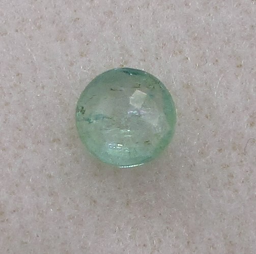 0.46 Carat Green Emerald, 5.6 mm Round, Very Slightly Included. COA