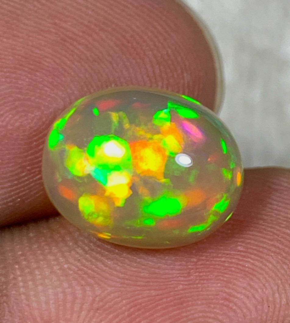 Natural Orange Ethiopian Welo Opal Rare Harlequin Pattern 4 Carats Oval Cabochon