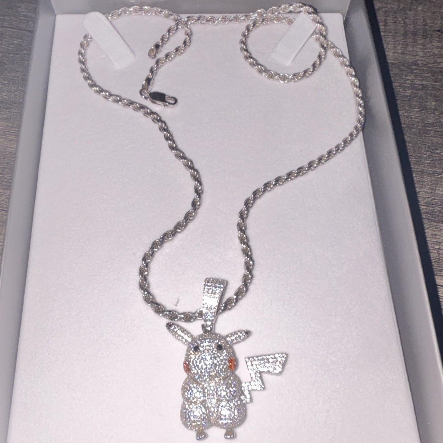 Iced out Pikachu pendant with moissanite diamonds and 92.5 silver roper chain