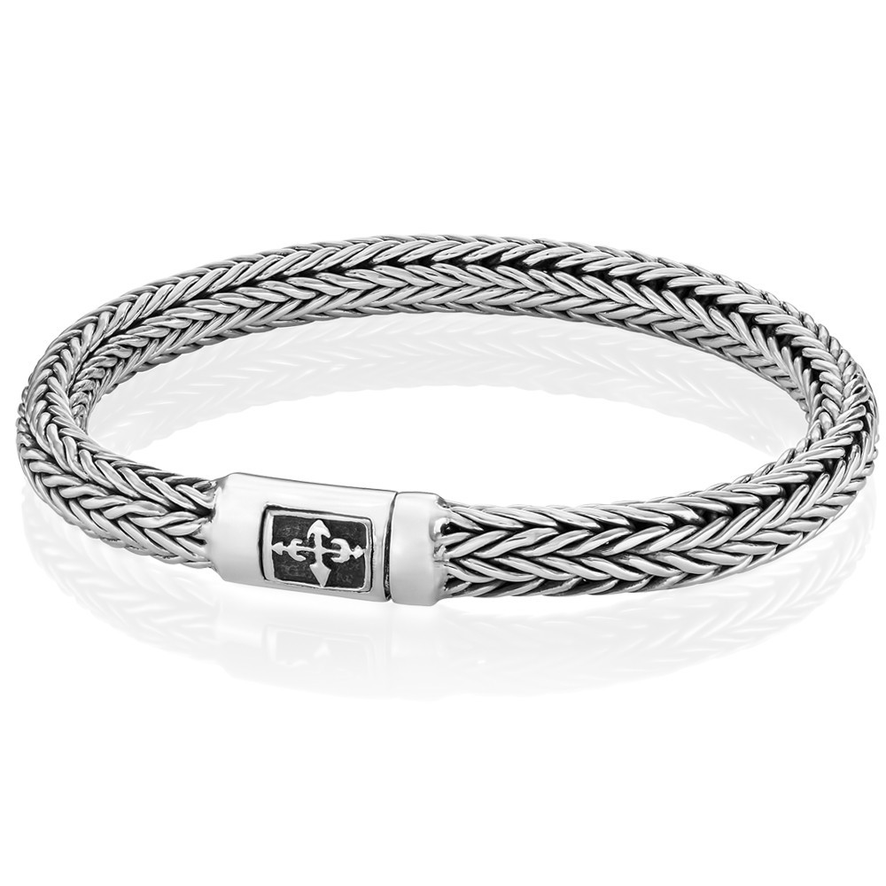 Sleek silver cross bracelet blending faith and modern style for everyday wear.