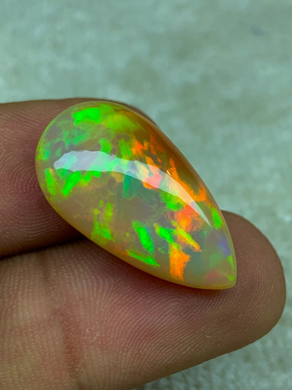 Natural Ethiopian Opal Honeycomb Pattern 14.90 Carat Multi-Fire Pear Cabochon