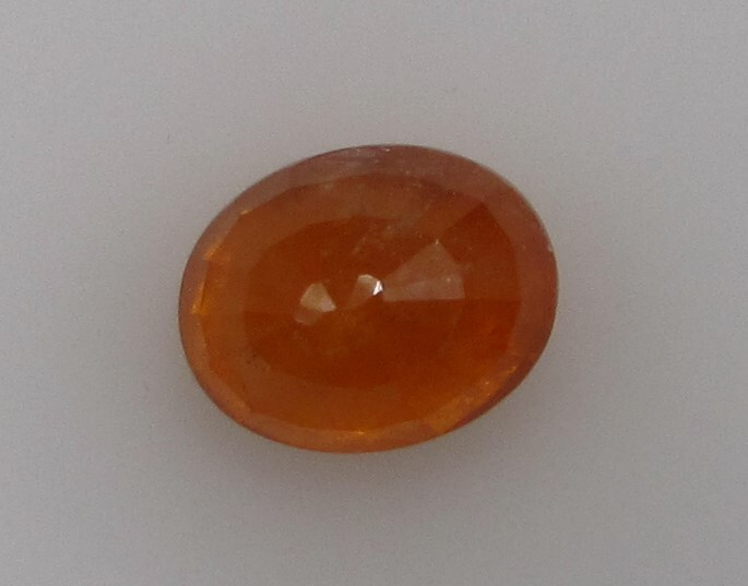 5.02 Carat, Yellow Orange Tangerine Garnet, 10 x 8 Oval, Very Slightly Included.