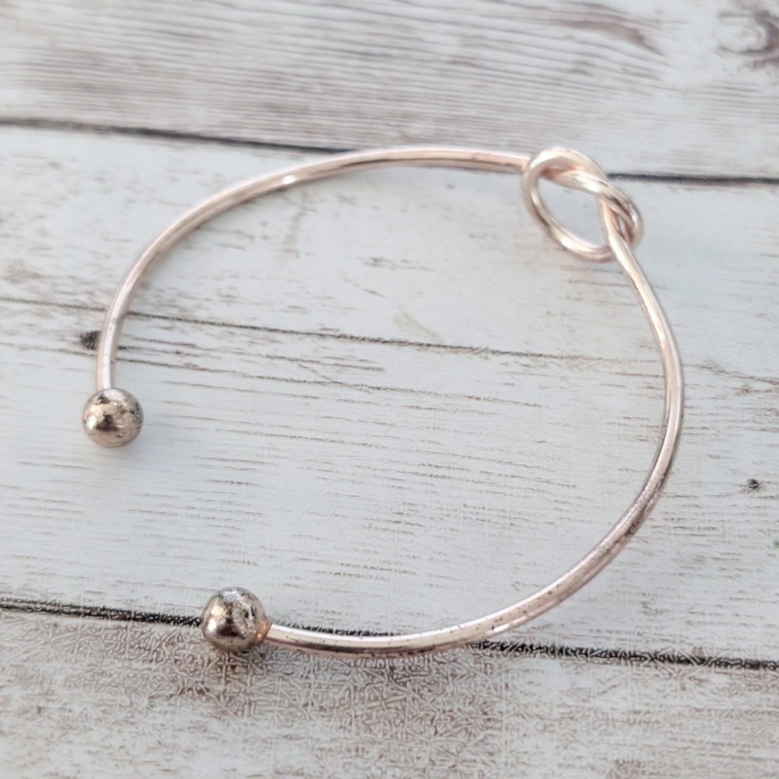 Very Light Shade of Rose Gold Tone Knot Bracelet – Condition Issues