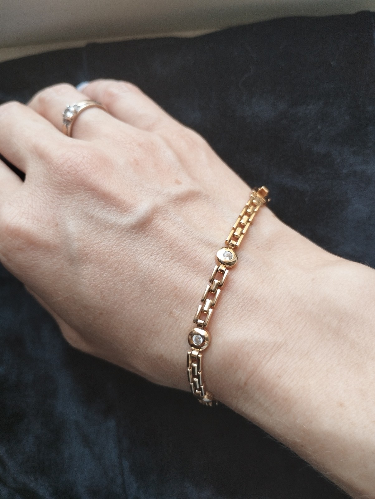 Gold-colored bracelet.