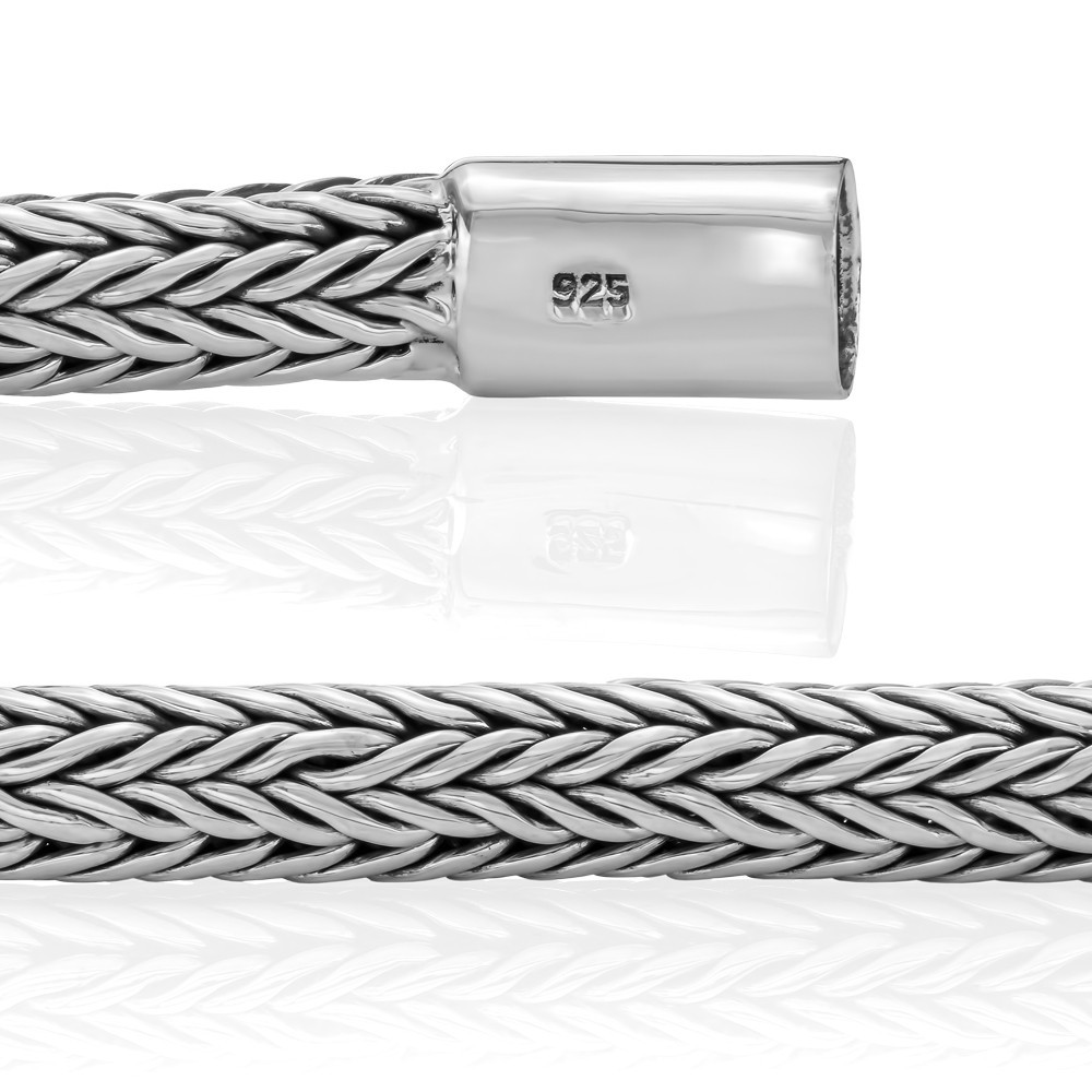 Sleek silver cross bracelet blending faith and modern style for everyday wear.
