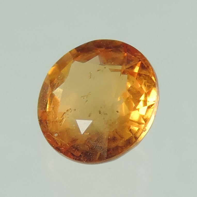 orange sapphire faceted round cut, sri lanka, 0.9 cts #83