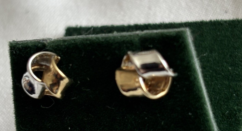 Two tone 9 carat gold twisted stud earrings.