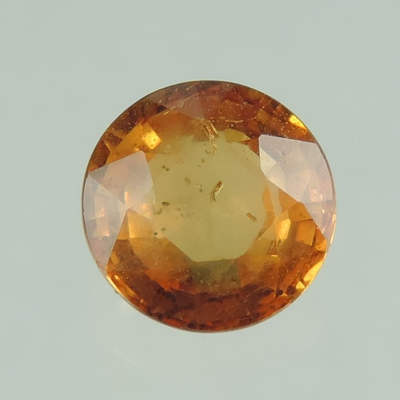 orange sapphire faceted round cut, sri lanka, 0.9 cts #83