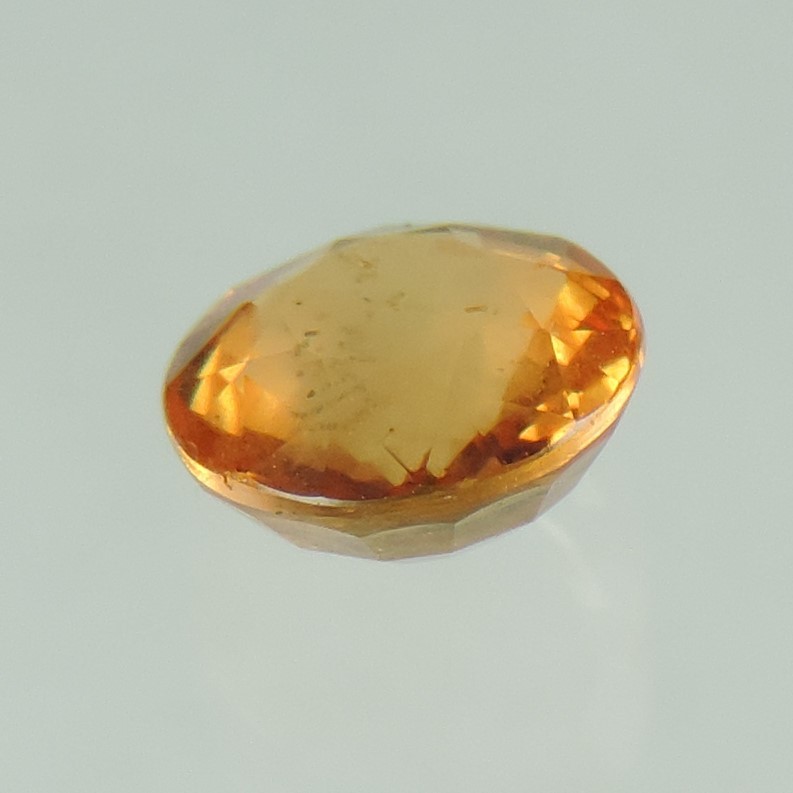 orange sapphire faceted round cut, sri lanka, 0.9 cts #83