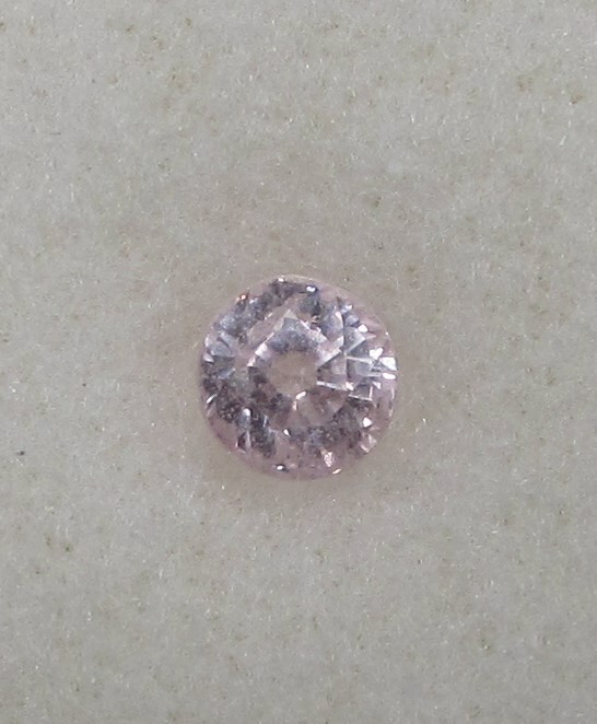 0.86 Carat Light Pink Sapphire, 4.5 mm Round, Very Slightly Included. COA.