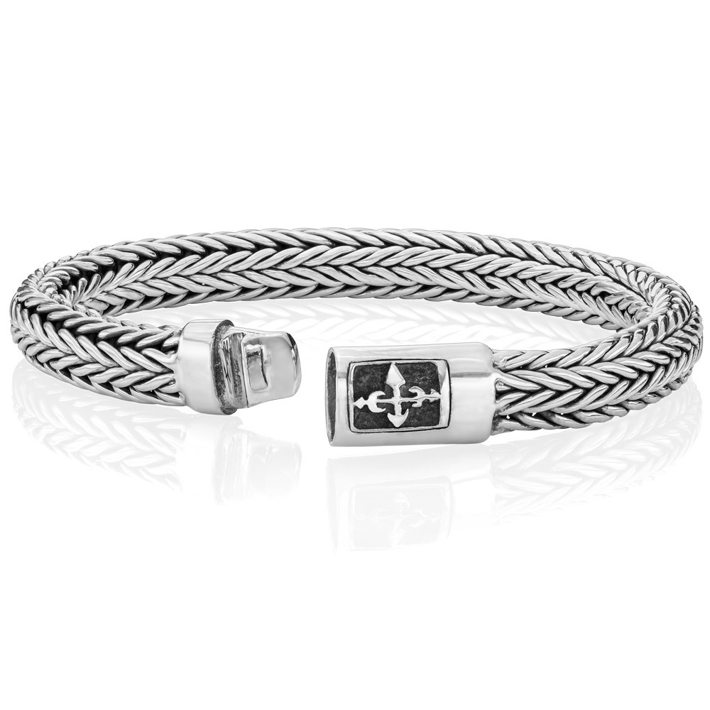 Sleek silver cross bracelet blending faith and modern style for everyday wear.