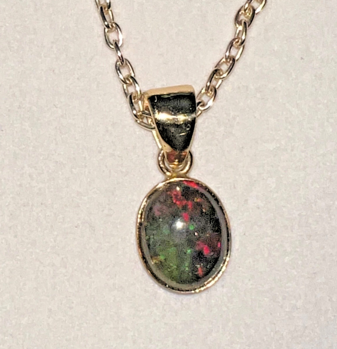Ethiopian Opal Pendant by Charles Albert – Zero Karat Gold – Red Green Fire