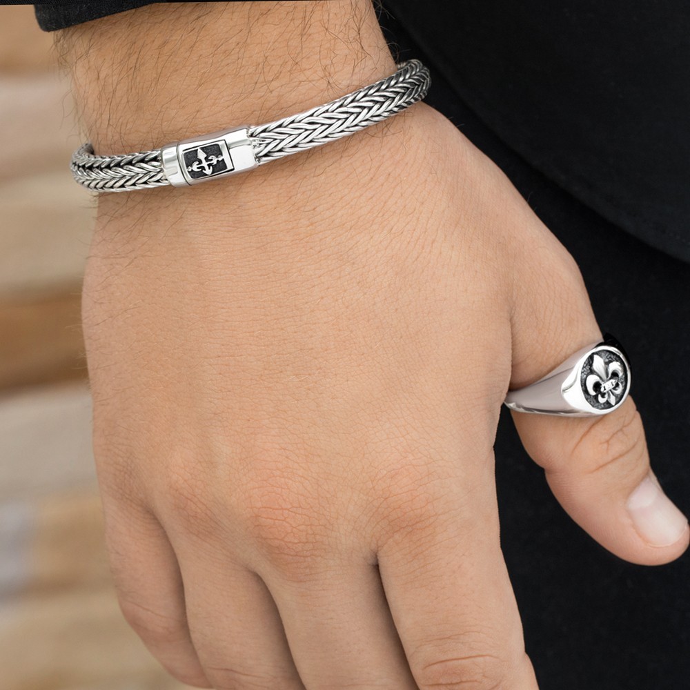 Sleek silver cross bracelet blending faith and modern style for everyday wear.
