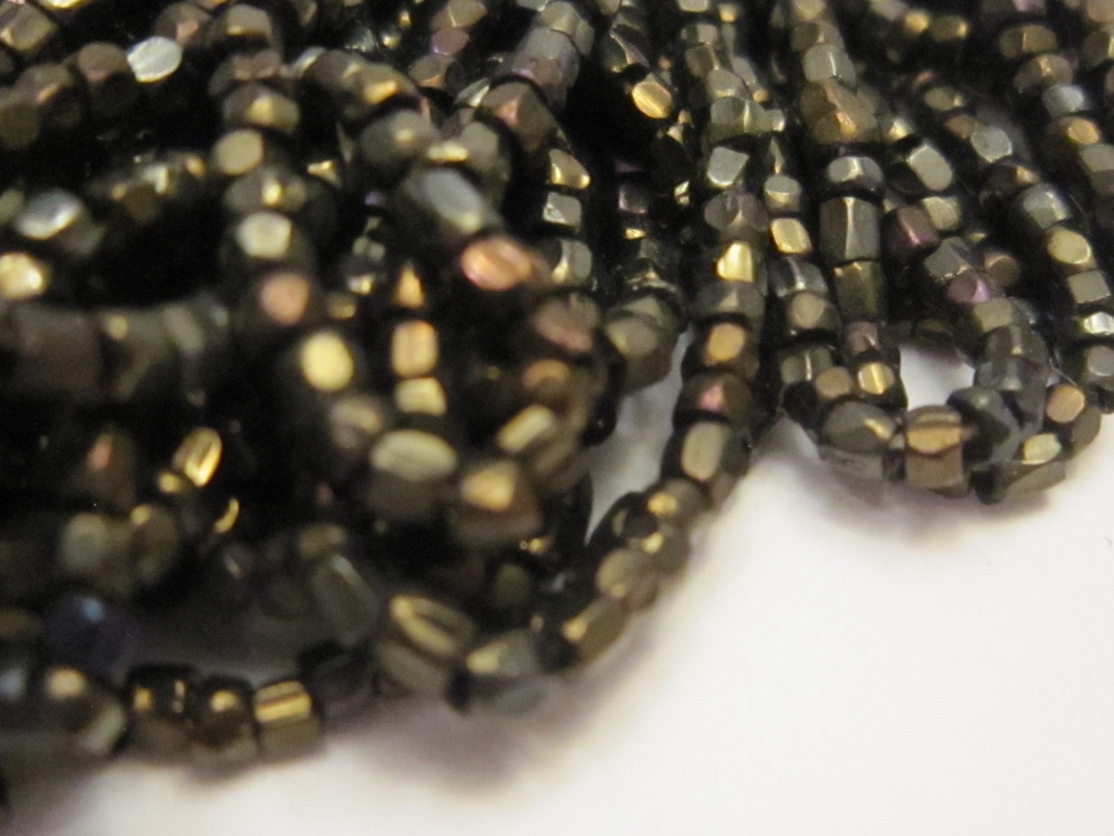 Hank Czech vintage dark topaz lustre faceted micro seed glass beads