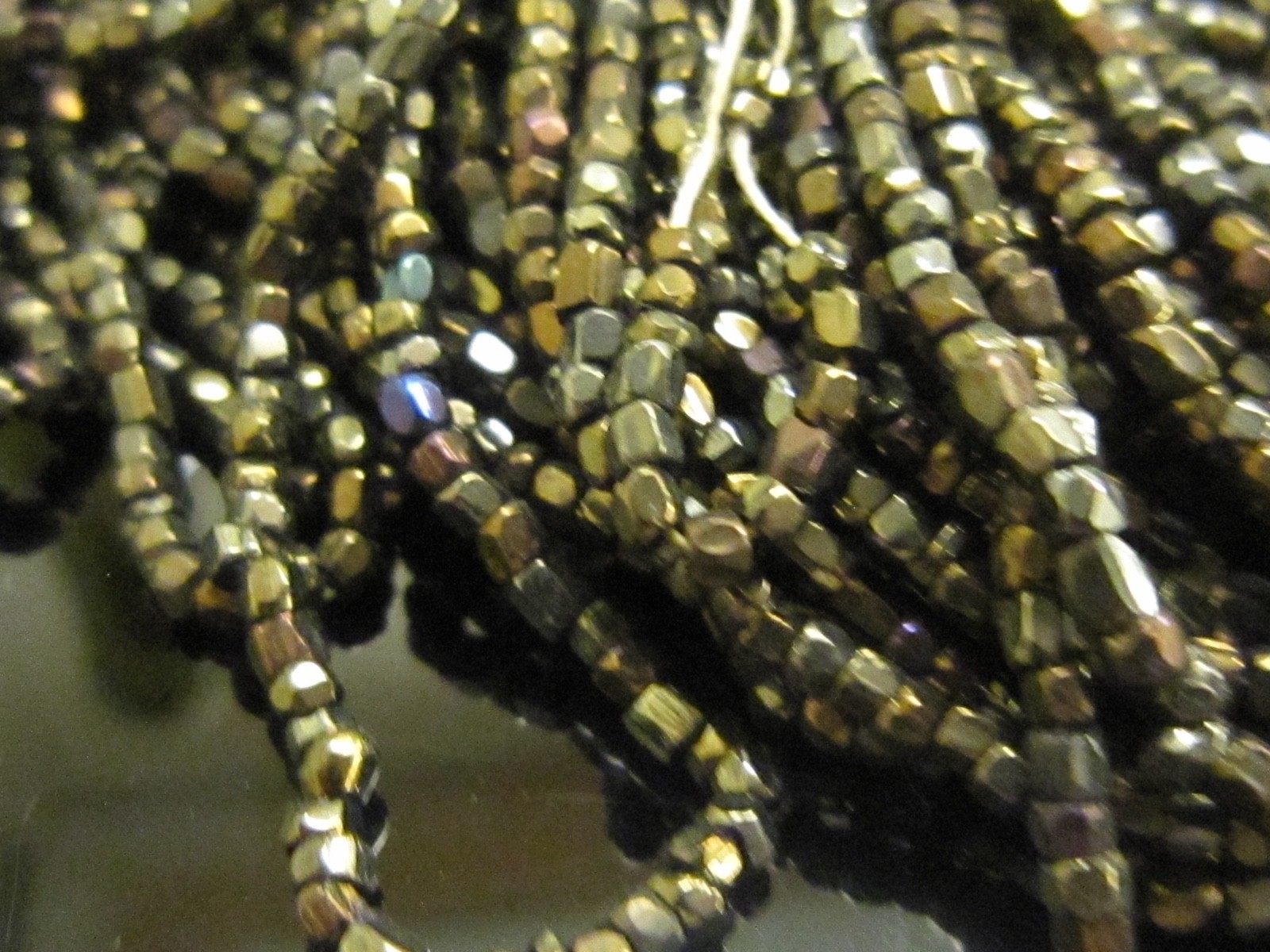 Hank Czech vintage dark topaz lustre faceted micro seed glass beads