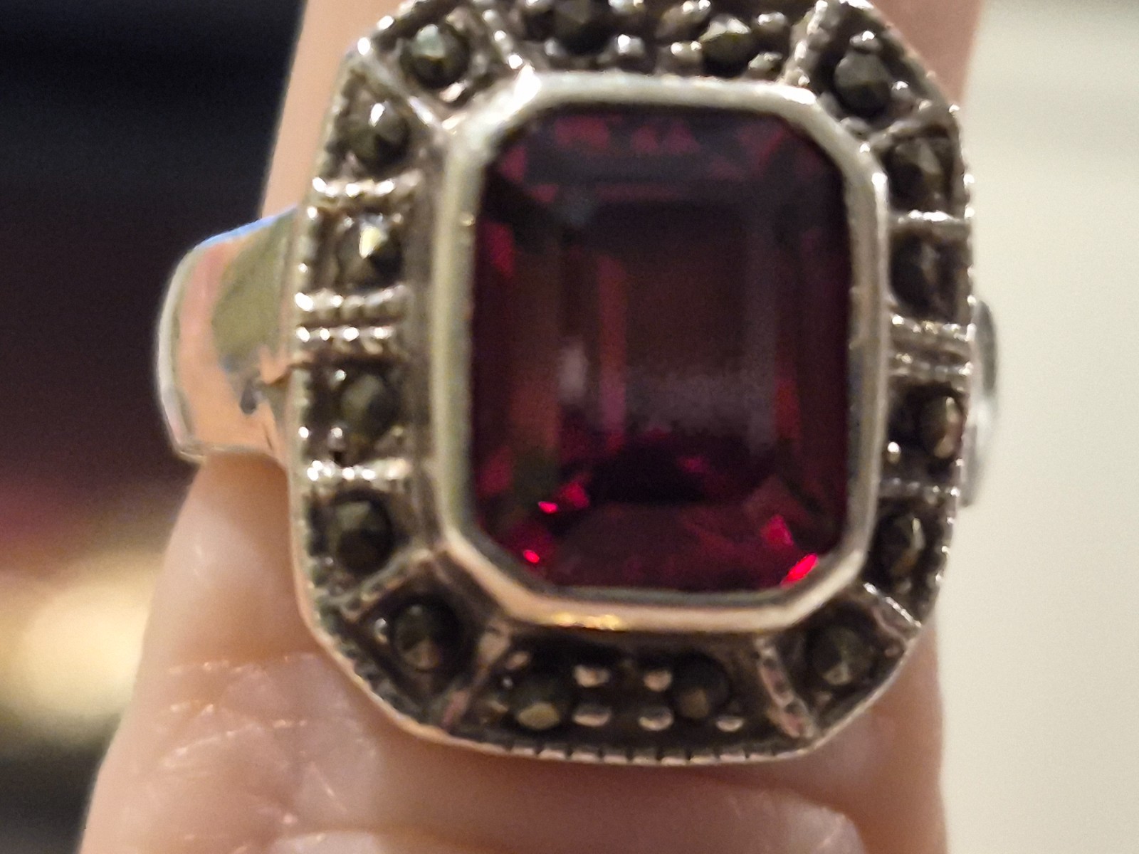 Art Deco garnet sterling silver ring with miniature stones surrounding the garne