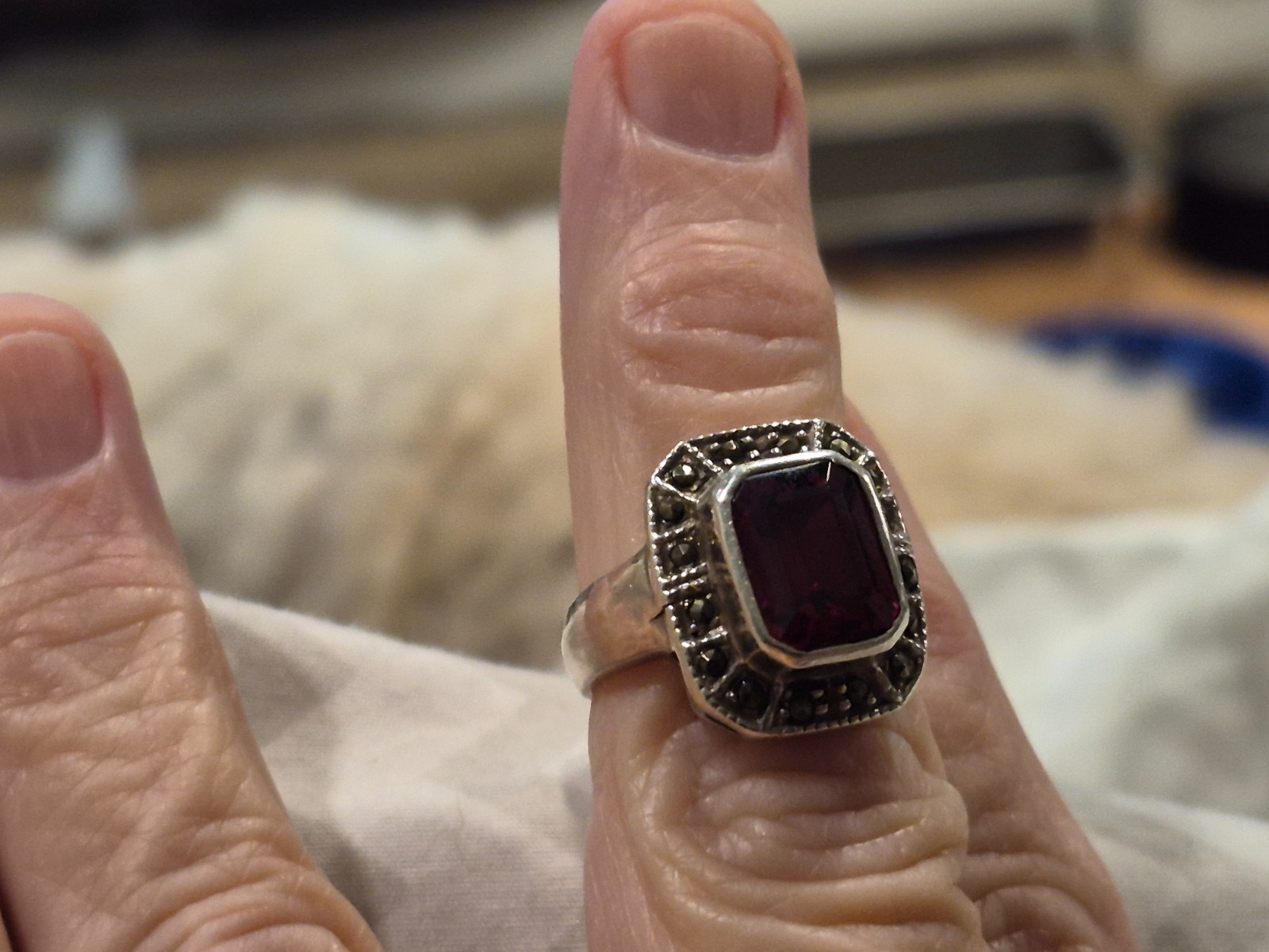 Art Deco garnet sterling silver ring with miniature stones surrounding the garne