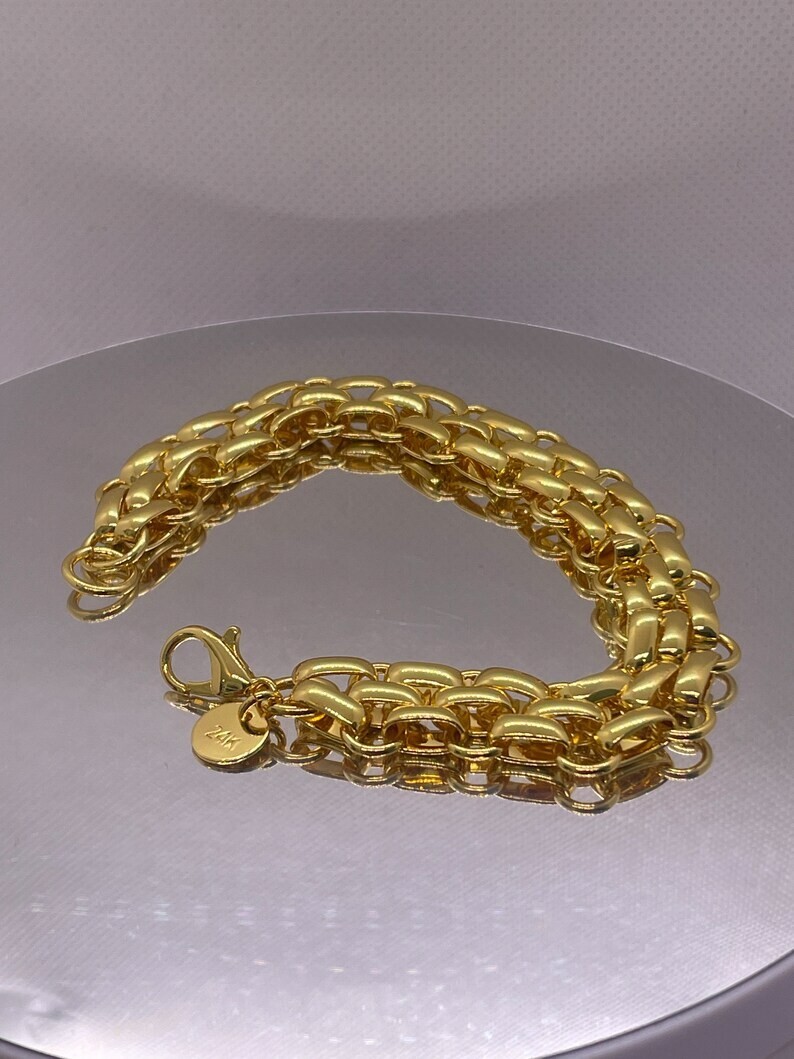 Interlocking circle bracelet 24k yellow gold over 925 sterling silver 7.5” long
