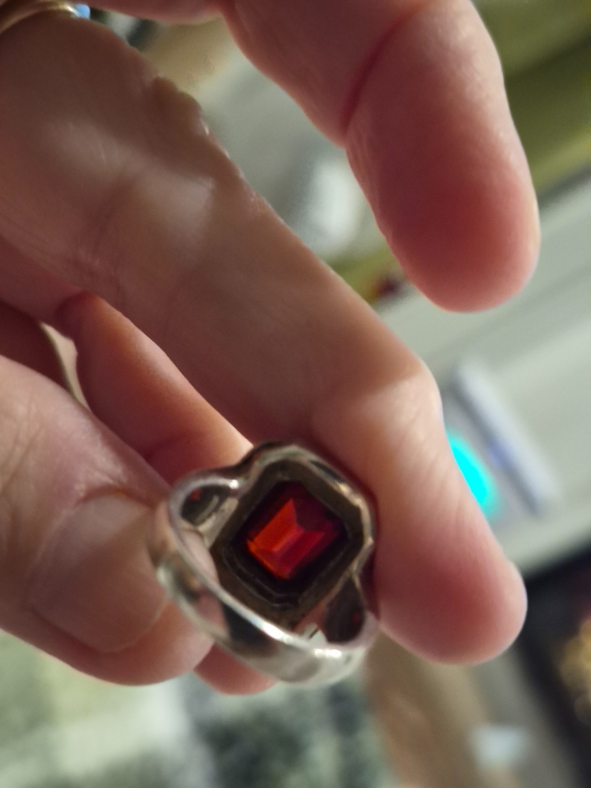 Art Deco garnet sterling silver ring with miniature stones surrounding the garne