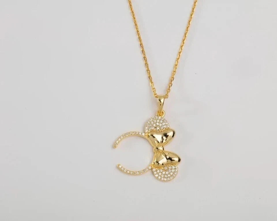 Sterling Silver Gold Finished -Tone Bow Pendant Necklace with Crystal Accents