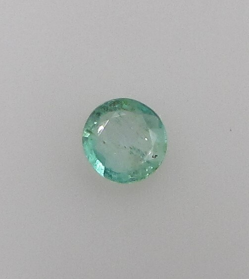 0.46 Carat Green Emerald, 5.6 mm Round, Very Slightly Included. COA