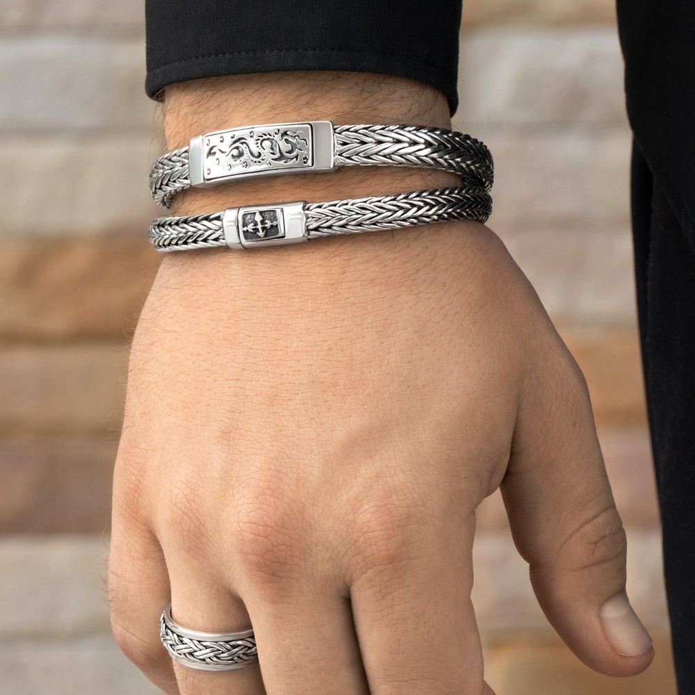 Sleek silver cross bracelet blending faith and modern style for everyday wear.