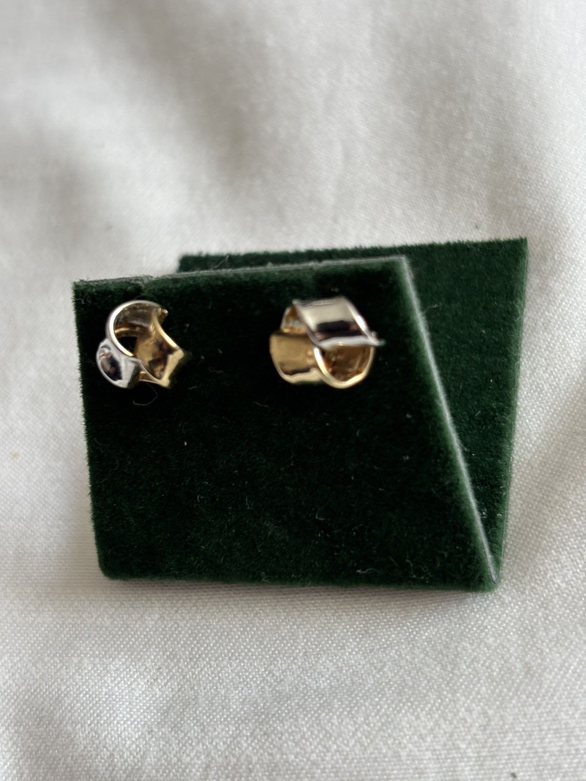 Two tone 9 carat gold twisted stud earrings.