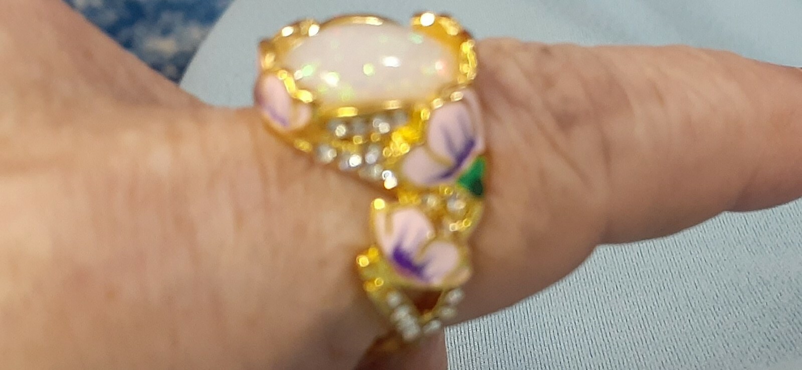 ring, exquiste women’s ring oval cut fire opal (lab creation) with cz’s on band