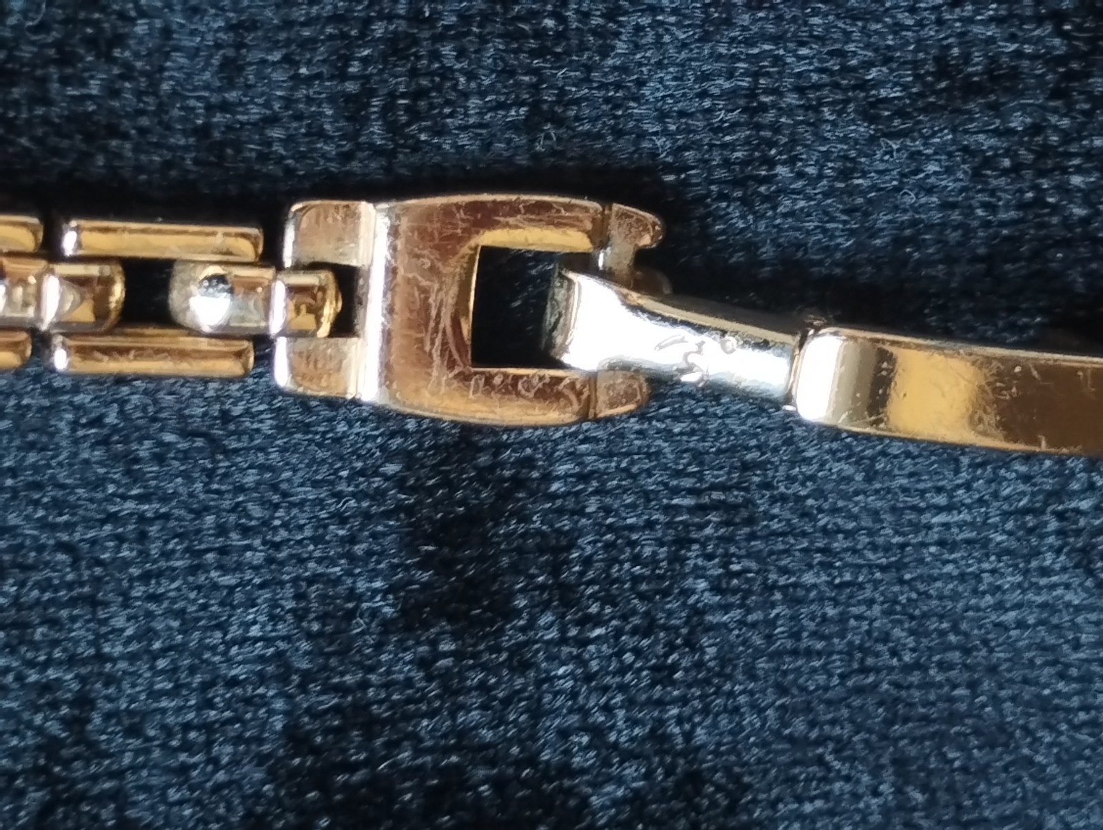 Gold-colored bracelet.
