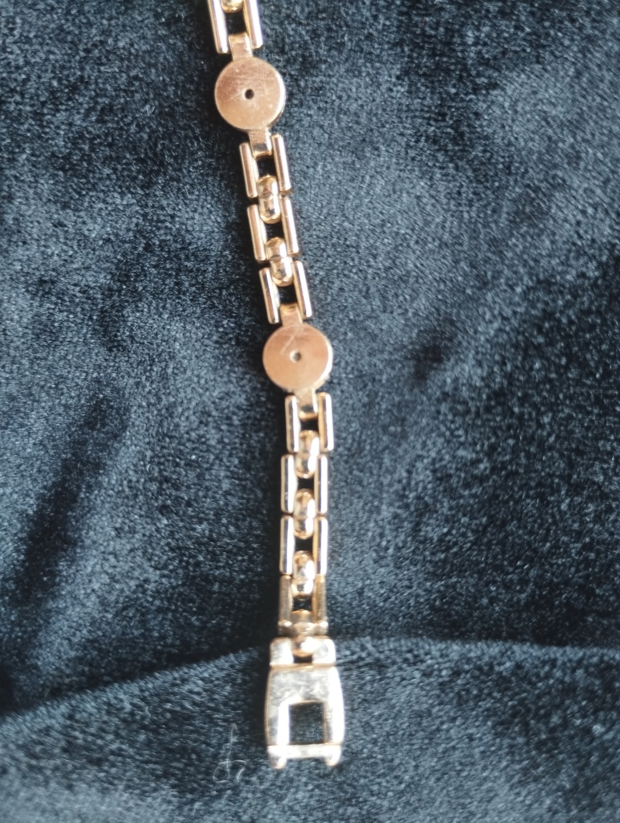 Gold-colored bracelet.