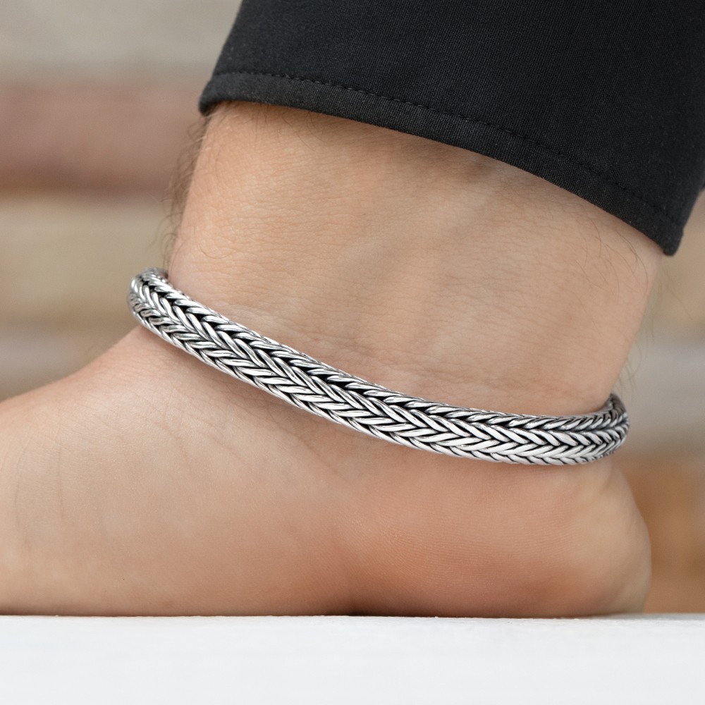 Sleek silver cross bracelet blending faith and modern style for everyday wear.