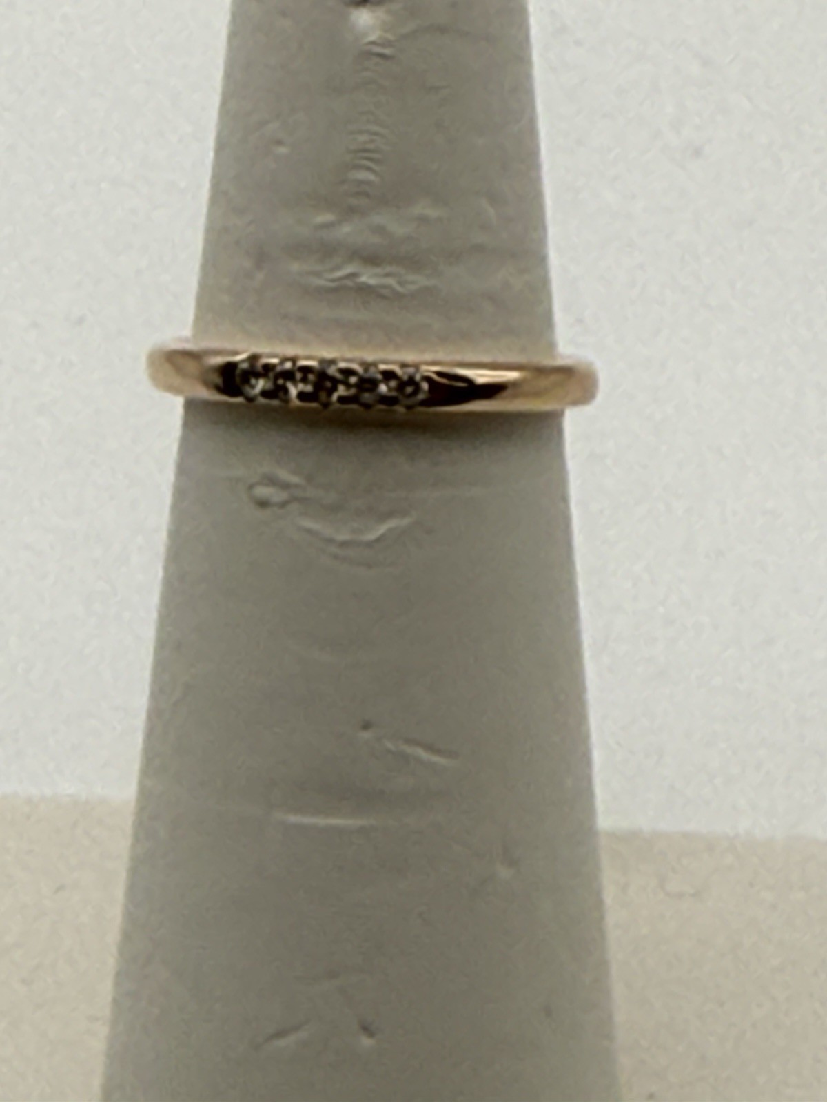 Brand new 14KT rose gold natural diamond ring. It has 2.5 grams & .11ct diamonds