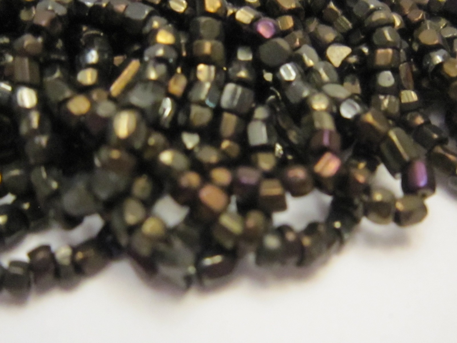 Hank Czech vintage dark topaz lustre faceted micro seed glass beads