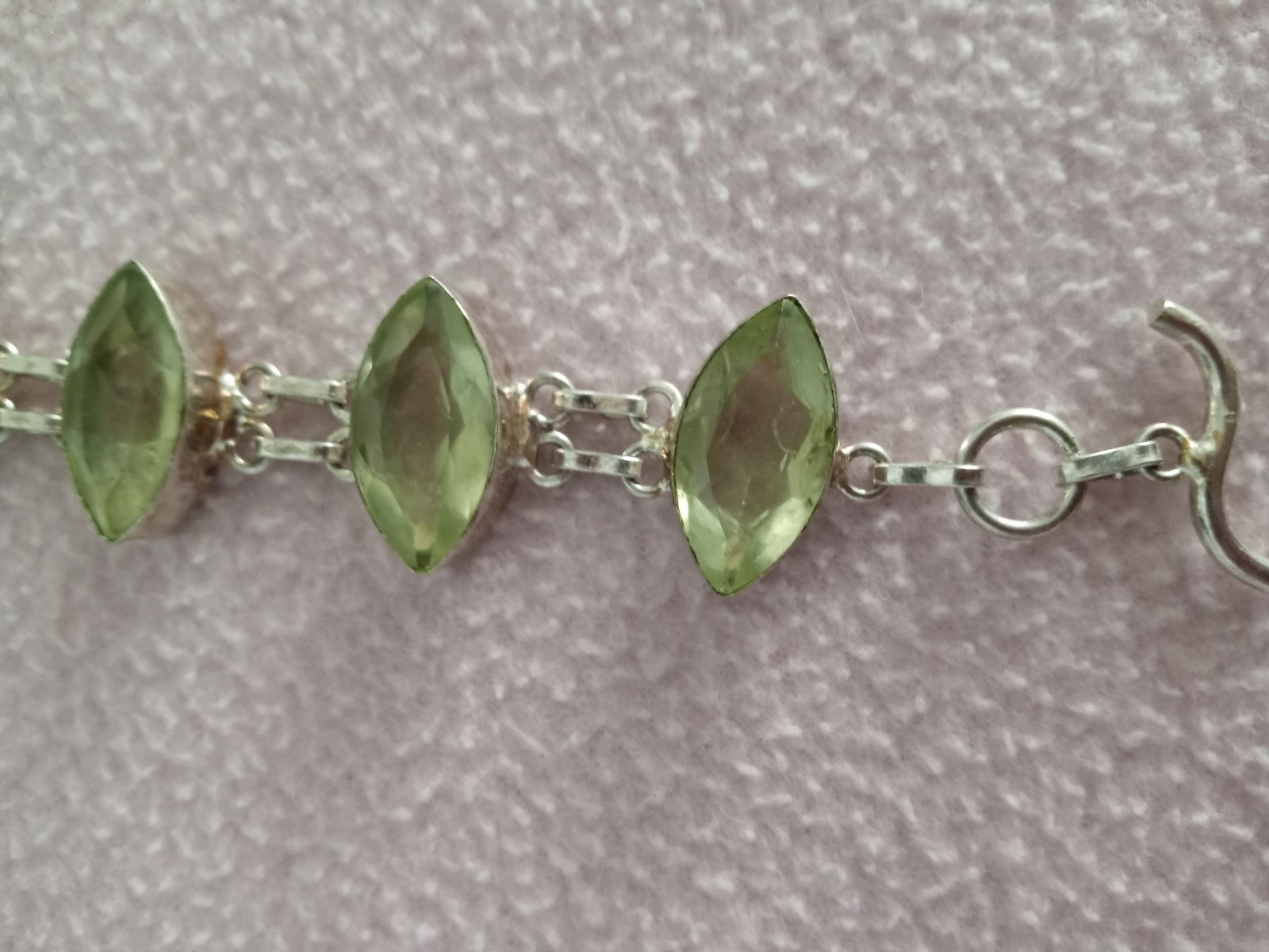 7 inch Bracelet with 5 faceted pale green stones set in silver
