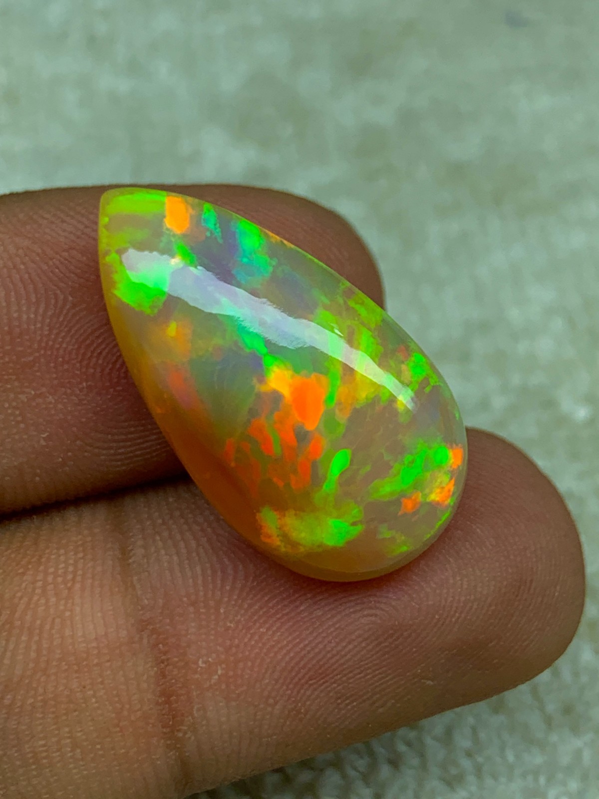 Natural Ethiopian Opal Honeycomb Pattern 14.90 Carat Multi-Fire Pear Cabochon
