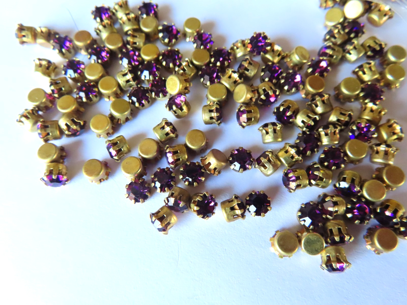 144 Swarovski Rhinestones 32pp Amethyst/Brass Tiff. Settings.