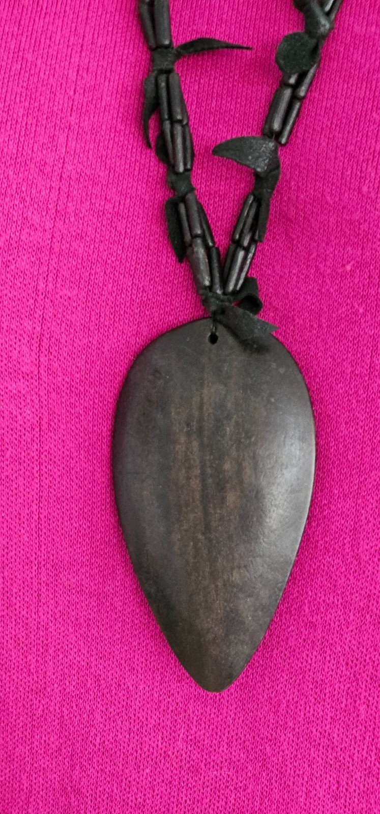 Rare long necklace wood and leather very light weight material. Monies maybe??